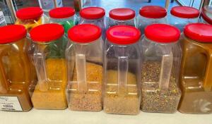 (12) ASSORTED CONTAINERS OF COLORED SUGARS, SPRINKLES, AND TOPPINGS.