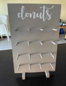 (2) ASSORTED WOODEN TABLE TOP DONUT WALL. HOLDS 16 DONUTS EACH