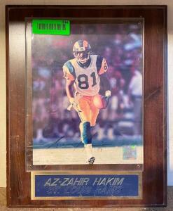 "AZ ZAHIR HAKIM" ST. LOUIS RAMS SIGNED PHOTO (FRAME IS DAMAGED)