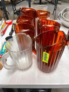 (9) ASSORTED PLASTIC PITCHERS.