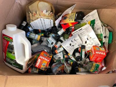 BOX OF ASSORTED RAINBIRD SPRINKLER FITTINGS AND ASSORTED LAWN CARE PRODUCTS.