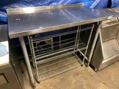 DESCRIPTION: 48" X 24" STAINLESS TABLE W/ WIRE UNDER SHELF ADDITIONAL INFORMATION W/ 1" BACK SPLASH SIZE: 48' X 24" LOCATION: BAY 7 QTY: 1