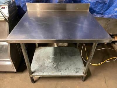 DESCRIPTION: 36" X 30" HEAVY DUTY STAINLESS TABLE W/ 3" BACK SPLASH SIZE: 36" X 30" LOCATION: BAY 7 QTY: 1