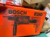 DESCRIPTION: (1) BULLDOG ROTARY HAMMER BRAND/MODEL: BOSCH/11210VSR INFORMATION: ORANGE CASE/BUNCH OF MISC PART IN CASE, SEE FOR INSPECTION RETAIL$: 14 - 2