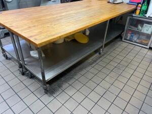 DESCRIPTION: 11' X 30" BUTCHER BLOCK TABLE TOP W/ STAINLESS BASE. ON CASTERS ADDITIONAL INFORMATION HEAVY DUTY SIZE 11' X 30" LOCATION: KITCHEN QTY: 1