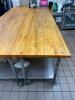 DESCRIPTION: 11' X 30" BUTCHER BLOCK TABLE TOP W/ STAINLESS BASE. ON CASTERS ADDITIONAL INFORMATION HEAVY DUTY SIZE 11' X 30" LOCATION: KITCHEN QTY: 1 - 2