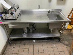 DESCRIPTION: 76" X 30" HEAVY DUTY STAINLESS TABLE W/ RIGHT HAND SINK. ADDITIONAL INFORMATION W/ 6" BACK SPLASH SIZE 76" X 30" LOCATION: KITCHEN QTY: 1