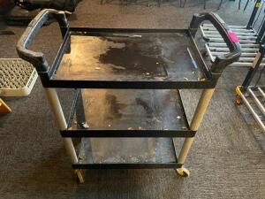 DESCRIPTION: THREE TIER BLACK PLASTIC BUS CART LOCATION: SEATING QTY: 1