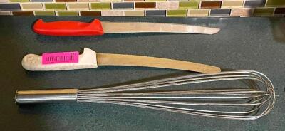 DESCRIPTION: (2) BREAD KNIVES AND (1) WHISK LOCATION: SEATING THIS LOT IS: ONE MONEY QTY: 1