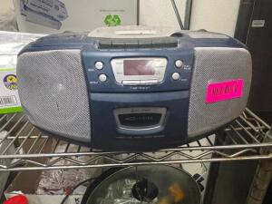 DESCRIPTION: AM / FM CD PLAYER BOOM BOX LOCATION: KITCHEN QTY: 1