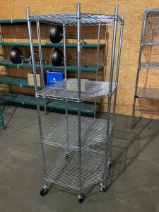 DESCRIPTION: 27" X 27" WIRE CORNER SHELF ON CASTERS - FOUR TIER SIZE: 27" X 27" X 72" LOCATION: 7 QTY: 1