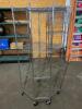 DESCRIPTION: 27" X 27" WIRE CORNER SHELF ON CASTERS - FOUR TIER SIZE: 27" X 27" X 72" LOCATION: 7 QTY: 1 - 2