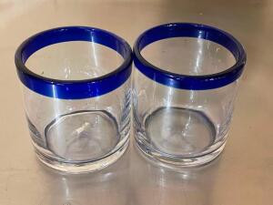 DESCRIPTION: (16) ROUND GLASSES W/ BLUE RIM LOCATION: 7 THIS LOT IS: SOLD BY THE PIECE QTY: 16