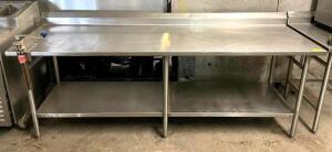 DESCRIPTION: 8' STAINLESS STEEL TABLE WITH BACKSPLASH AND WELDED LEGS WITH UNDERSHELF INFORMATION: HAS CAN OPENER ATTACHMENT SIZE: 96"X30" QTY: 1