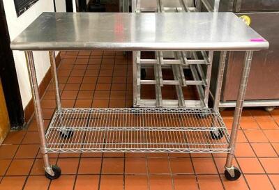 STAINLESS STEEL TABLE WITH WIRE UNDERSHELF ON CASTERS