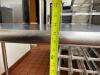 STAINLESS STEEL TABLE WITH WIRE UNDERSHELF ON CASTERS - 4