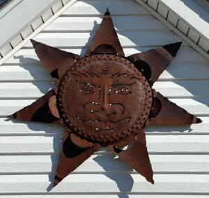 DESCRIPTION: LARGE METAL SUN DECORATION LOCATION: HOUSE #2 LOCATION: 6521 WOODLAND DRIVE CEDAR HILL, MO 63016 QTY: 1