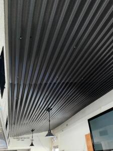 ALL GALVANIZED METAL ROOFING MATERIAL ON INTERIOR CEILING.