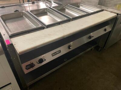 DESCRIPTION: VOLLRATH FOUR WELL ELECTRIC STEAM TABLE. MODEL VOLLRATH 38104 ADDITIONAL INFORMATION: 120 VOLT, 2800 WATT, 23.3 AMP QTY: 1