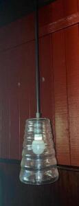 DESCRIPTION: (8) CLEAR GLASS PENDANT LIGHT FIXTURES. LOCATION: BAR THIS LOT IS: SOLD BY THE PIECE QTY: 8