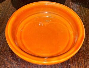 DESCRIPTION: (24) 6.5" ORANGE CERAMIC PLATES SIZE 6.5" LOCATION: BAR THIS LOT IS: SOLD BY THE PIECE QTY: 24