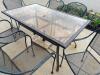 60" X 37" GLASS TOP PATIO TABLE W/ (6) WROUGHT IRON CHAIRS. - 4