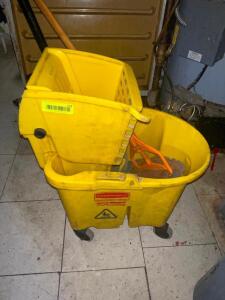 YELLOW MOP BUCKET AND WRINGER.