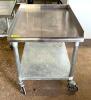 24" STAINLESS STEEL EQUIPMENT STAND ON CASTERS