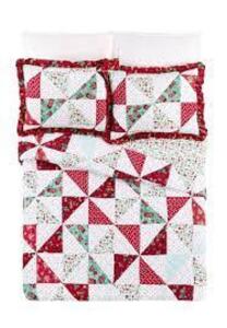 DESCRIPTION: (1) QUILT SET BRAND/MODEL: THE PIONEER WOMAN INFORMATION: PINWHEEL RETAIL$: $59.98 EA SIZE: 3 PIECE QTY: 1