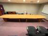 DESCRIPTION: 18' WOODEN CONFERENCE TABLE INFORMATION: TWO PIECES SIZE: 18' X 4' LOCATION: UPSTAIRS OFFICE QTY: 1 - 3