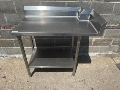 DESCRIPTION: CUSTOM 42" X 24" ALL STAINLESS TABLE W/ 4" BACK SPLASH. SIZE 42" X 24" LOCATION: BAY 6 QTY: 1