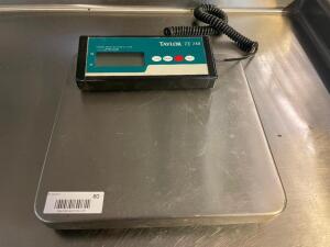 DESCRIPTION: TAYLOR TE150 150 LB. DIGITAL PORTION SCALE BRAND / MODEL: TAYLOR TE150 LOCATION: BAY 6 QTY: 1