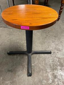 DESCRIPTION: 24" ROUND HARDWOOD TABLE W/ BASE. ADDITIONAL INFORMATION TAKEN APART SIZE 24" R LOCATION: BAY 6 QTY: 1