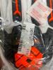 DESCRIPTION (4) TILSATEC KNUCKLEGUARD LEATHER GLOVES BRAND/MODEL TTP230KG9 ADDITIONAL INFORMATION WHITE, BLACK & ORANGE/RETAILS AT $25.00 EACH SIZE XL - 2