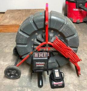 DESCRIPTION: RIDGID SEE SNAKE SC6 DIGITAL RECORDINNG MONITOR W/ RIDGID PORTABLE CAMERA REEL AS SHOWN RETAIL$: INCLUDES BATTERY AND CHARGER AS SHOWN LO