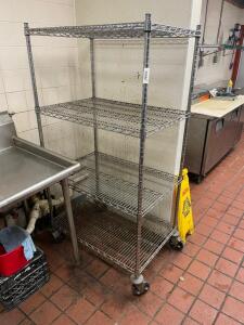 36" X 24" FOUR TIER WIRE SHELF ON CASTERS.