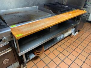 DESCRIPTION: 72" LOW BOY STAINLESS EQUIPMENT STAND W/ BUTCHER BLOCK FRONT RISER CUTTING BOARD. SIZE 72" X 30" LOCATION: KITCHEN QTY: 1