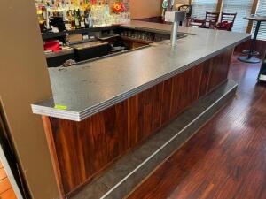 DESCRIPTION: 108" X 132" L SHAPED COMPOSITE TOP BAR W/ FRONT WOOD PANELING. SIZE 108" X 132" X 28.5" WIDE LOCATION: BAR QTY: 1