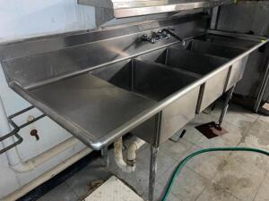 DESCRIPTION: 90" THREE WELL STAINLESS POT SINK W/ LEFT AND RIGHT DRY BOARDS. ADDITIONAL INFORMATION SINGLE FAUCET, DRAIN LEVERS SIZE 90" LOCATION: BAS