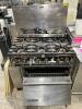 DESCRIPTION: SIX BURNER GAS RANGE - MISSING PARTS ADDITIONAL INFORMATION SOLD FOR PARTS OR SALVAGE. LOCATION: AREA #5 QTY: 1