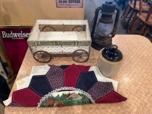 DESCRIPTION: (4) PIECES OF DECORATION = WAGON, CERAMIC JUG, LANTERN, AND QUILT LOCATION: SEATING THIS LOT IS: ONE MONEY QTY: 1