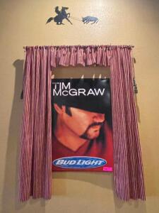 DESCRIPTION: " TIM MCGRAW METAL POSTER W/ WINDOW TREATMENT LOCATION: SEATING QTY: 1