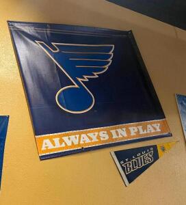 DESCRIPTION: (2) ST. LOUIS BLUES BANNERS AND (1) FLAG. ADDITIONAL INFORMATION SEE ADDITIONAL PHOTOS LOCATION: SEATING THIS LOT IS: ONE MONEY QTY: 1