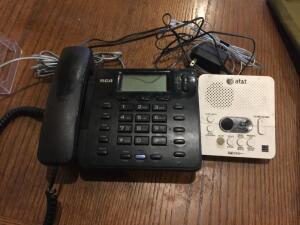 DESCRIPTION: (2)line phone and answering machine. LOCATION: KITCHEN QTY: 1