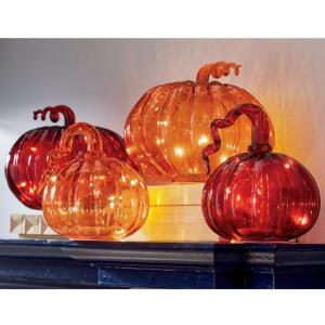 DESCRIPTION Set of 2 Lit Glass Pumpkins RED CONDITION Brand New - In Box - Retail - $49.99 ADDITIONAL INFO Glass pumpkins filled with white LEDs. Outd