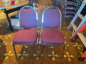 (8) STACK CHAIRS W/ MAROON UPHOLSTERED SEATS.