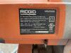 DESCRIPTION: RIDGID .10" DUAL BEVEL SLIDING COMPOUND MITER SAW BRAND / MODEL: RIDGID MS255SR ADDITIONAL INFORMATION W/ PORTABLE STAND LOCATION: PAINT - 4