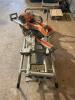 DESCRIPTION: RIDGID .10" DUAL BEVEL SLIDING COMPOUND MITER SAW BRAND / MODEL: RIDGID MS255SR ADDITIONAL INFORMATION W/ PORTABLE STAND LOCATION: PAINT - 5