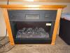 DESCRIPTION: 24" ELECTRIC FIREPLACE HEATER ADDITIONAL INFORMATION W/ WOODEN SURROUND LOCATION: OFFICE QTY: 1