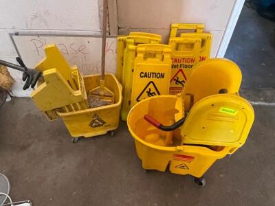 DESCRIPTION: (2) MOP BUCKETS AND (4) WET FLOOR SIGNS LOCATION: WAREHOUSE THIS LOT IS: ONE MONEY QTY: 1